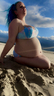 Pregnant mermaid on the beach