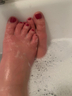 Soapy red toe nails fresh pedicure 